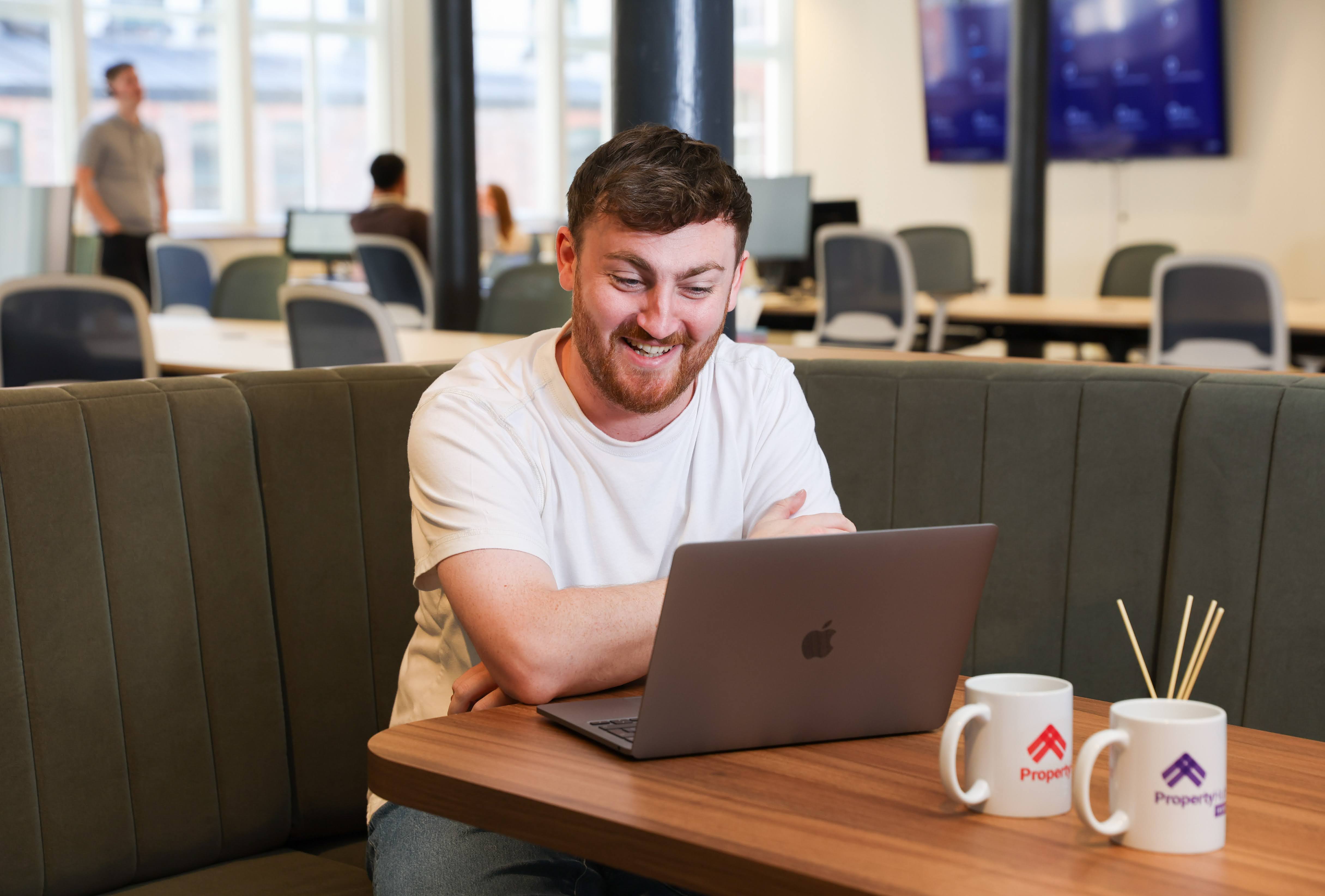 Property Hub team member reviewing data on a laptop